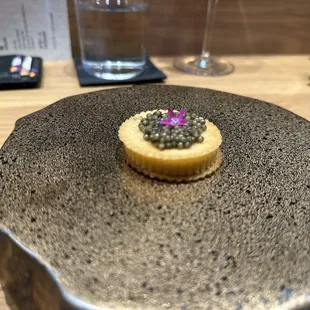 a piece of food on a plate on a table