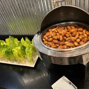 a pot of chicken and lettuce