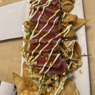 Ahi Tuna Nachos with Napa cabbage and wasabi sriracha sauce