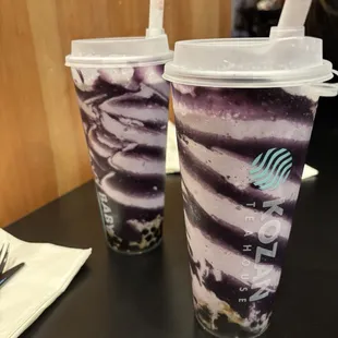 Taro and ube with boba. Made with vanilla ice cream and milk mixed in.