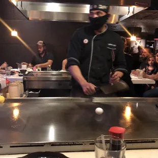 a chef preparing food in a restaurant
