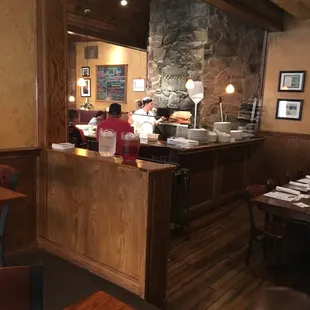 Kozmo's interior and brick pizza oven centerpiece