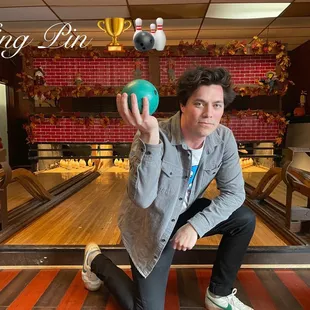 a man holding a bowling ball