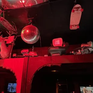 a bar with red lighting