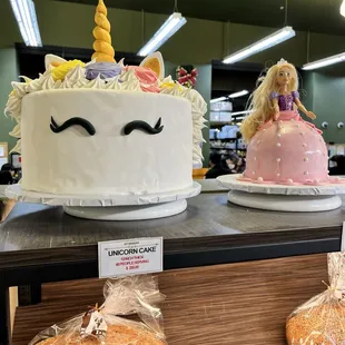 two unicorn cakes on display