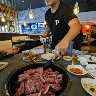 Our server Jason cooking our Beef Brisket.