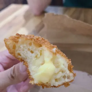 a person holding a piece of food