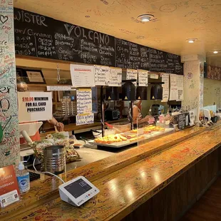 a counter with a variety of donuts