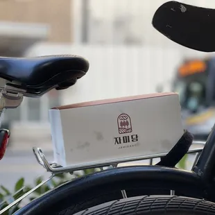 Cute box of donuts, fits perfect on a bike!