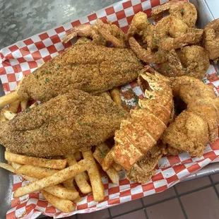 Fried lobster tail with shrimp and fish