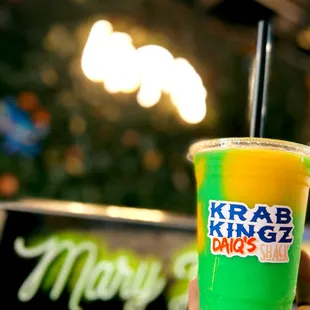 a hand holding a drink