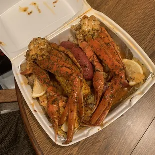 crab legs in a styrofoam container