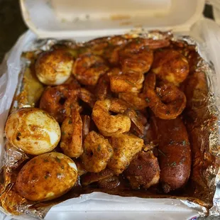 Boiled eggs, Potatoes, Sausage, #4 Large Boiled Shrimp Platter (I think) Spicy