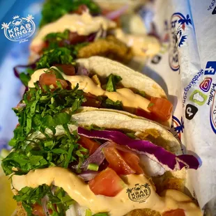 a row of fish tacos