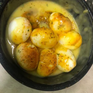Boiled eggs drowned in butter