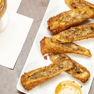 Boudin Egg Rolls are deep-fried egg rolls stuffed with delicious boudin and gooey cheese.