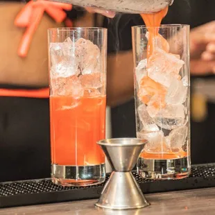 a bartender pouring a drink