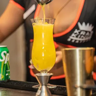 a bartender pouring a drink