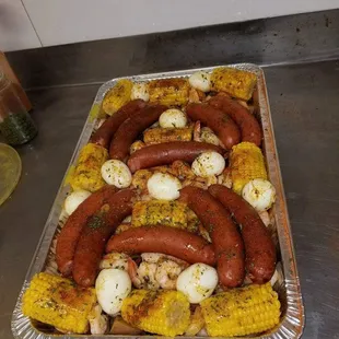 Side items: Corn, Sausage, Egg, and Potatoes.