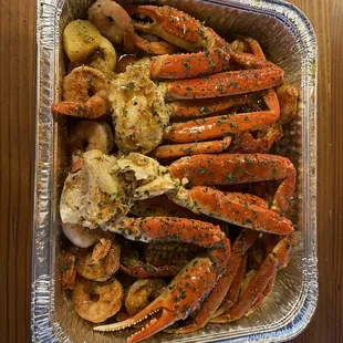 cooked crab legs and potatoes
