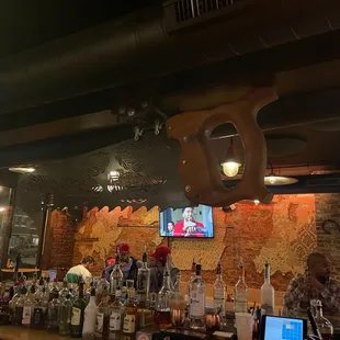 a bar with a bunch of bottles on the bar