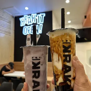 a hand holding a cup of coffee