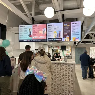 people standing in line at the counter
