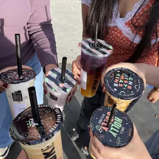 a group of people holding drinks