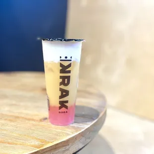 Moon Princess - 50% sweet, peachy green tea dressed in creamy pink crystal boba