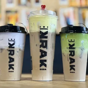 three different drinks on a table