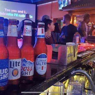 bottles of beer on a bar