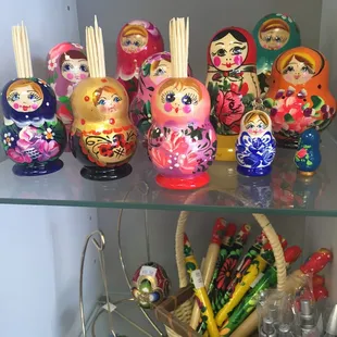 a shelf of russian dolls