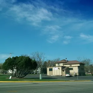 a small building on the corner of a street