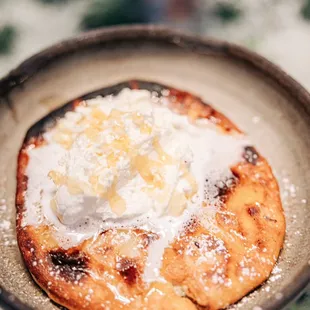 Sfakianopita (Cretan cheese pie, manouri, pistachio, honey, whipped cream)