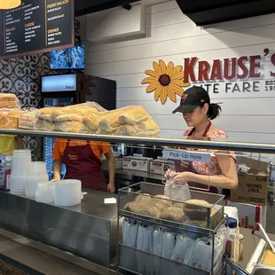 a woman behind the counter