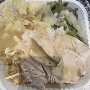 Turkey dinner  Sliced turkey,stuffing,mashed potatoes and green beans