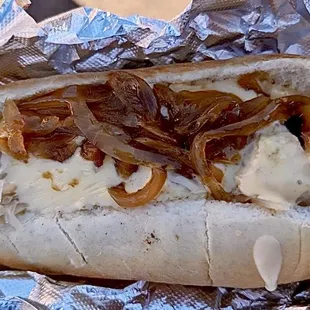 DRUNKEN COW: Bratwurst, Sauerkraut, Caramelized Onions, &amp; Beer Cheese Sauce