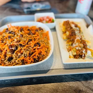 two trays of food on a table