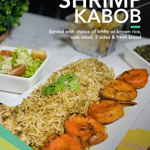 shrimp kabob served with choice of white or brown rice, side salads and fresh bread
