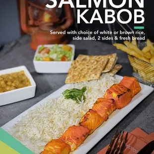 salmon kabob served with choice of white or brown rice, side salad, 2 sides and fresh bread