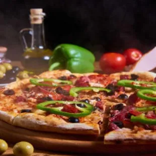 a pizza with pepperoni, olives, and ham