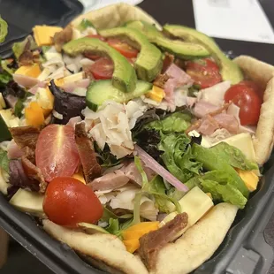 a salad in a plastic container