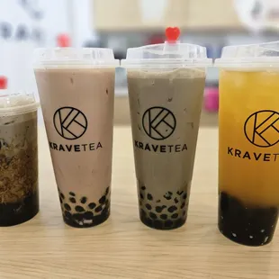 three different drinks on a table