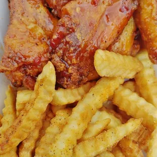 Pineapple jerk wings and French fries