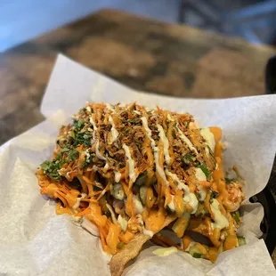 a plate of nachos on a table