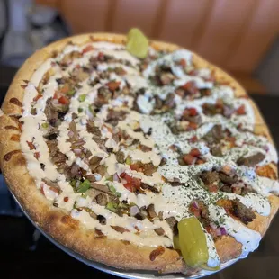 Half supreme kebab (left) and gyro (right) pizza
