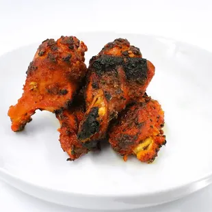 chicken wings on a white plate