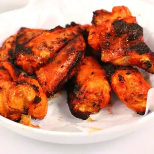 a bowl of chicken wings