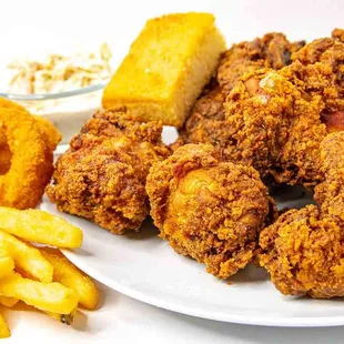Crispy chicken and our lovely sides of : fries, onion rings, coleslaw, corn bread