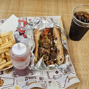 Cheese steak and fries with coke zero sugar
